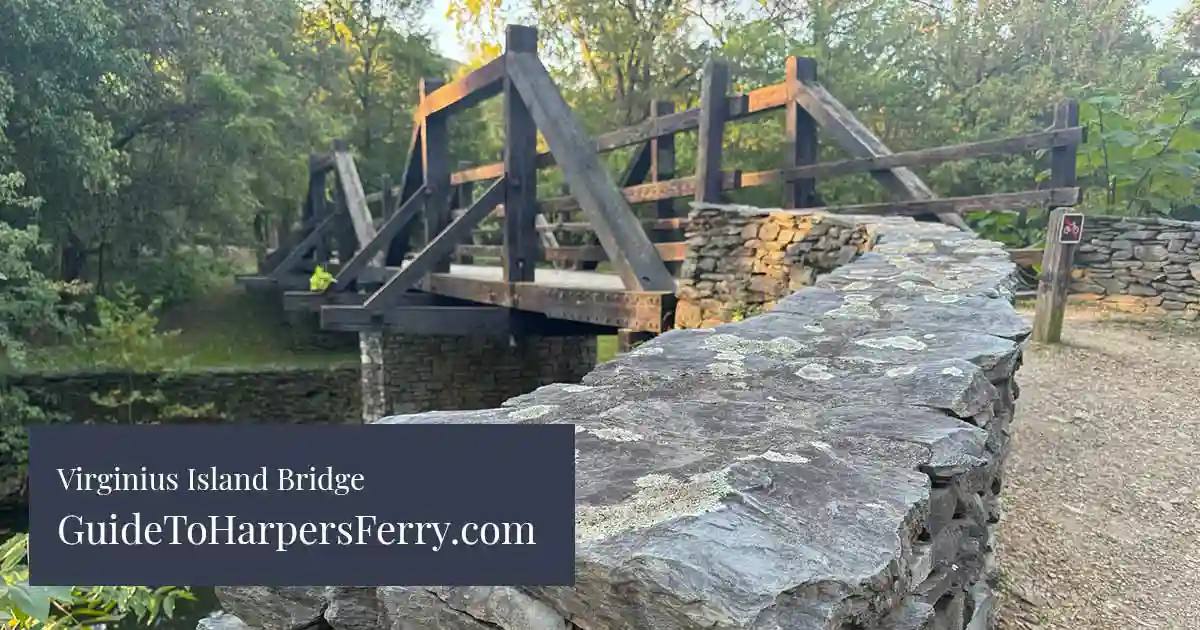 Harpers Ferry Virginius Island Bridge in Harpers Ferry. The bridge leads to the Virginius Island Trail, which passes through the Harpers Ferry historical industry sites and ruins on to other trails and areas in the park and town of Harpers Ferry.