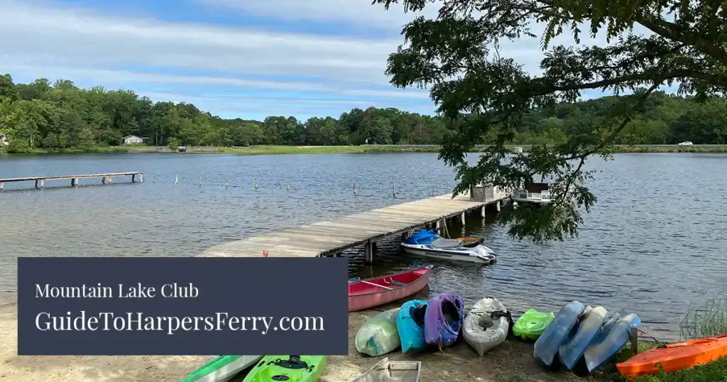 Kayaks, canoes, and paddle boards on the beach at Mountain Lake Club in Harpers Ferry.