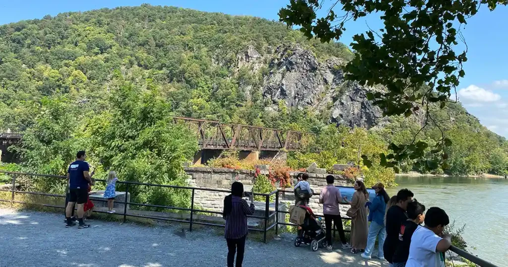 A view of tourists in Harpers Ferry enjoying the view from the Point.