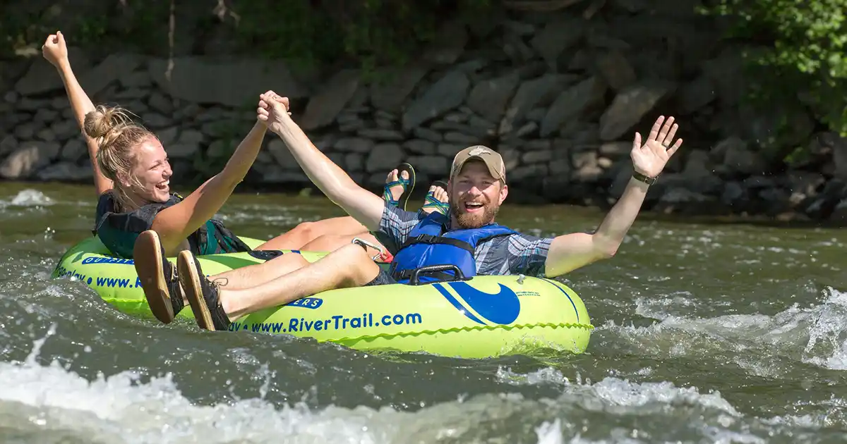 Couple enjoying river tubing with River & Trail Outfitters in Harpers Ferry, West Virginia